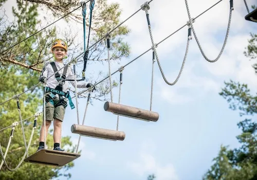 a kid enjoying the adventure park